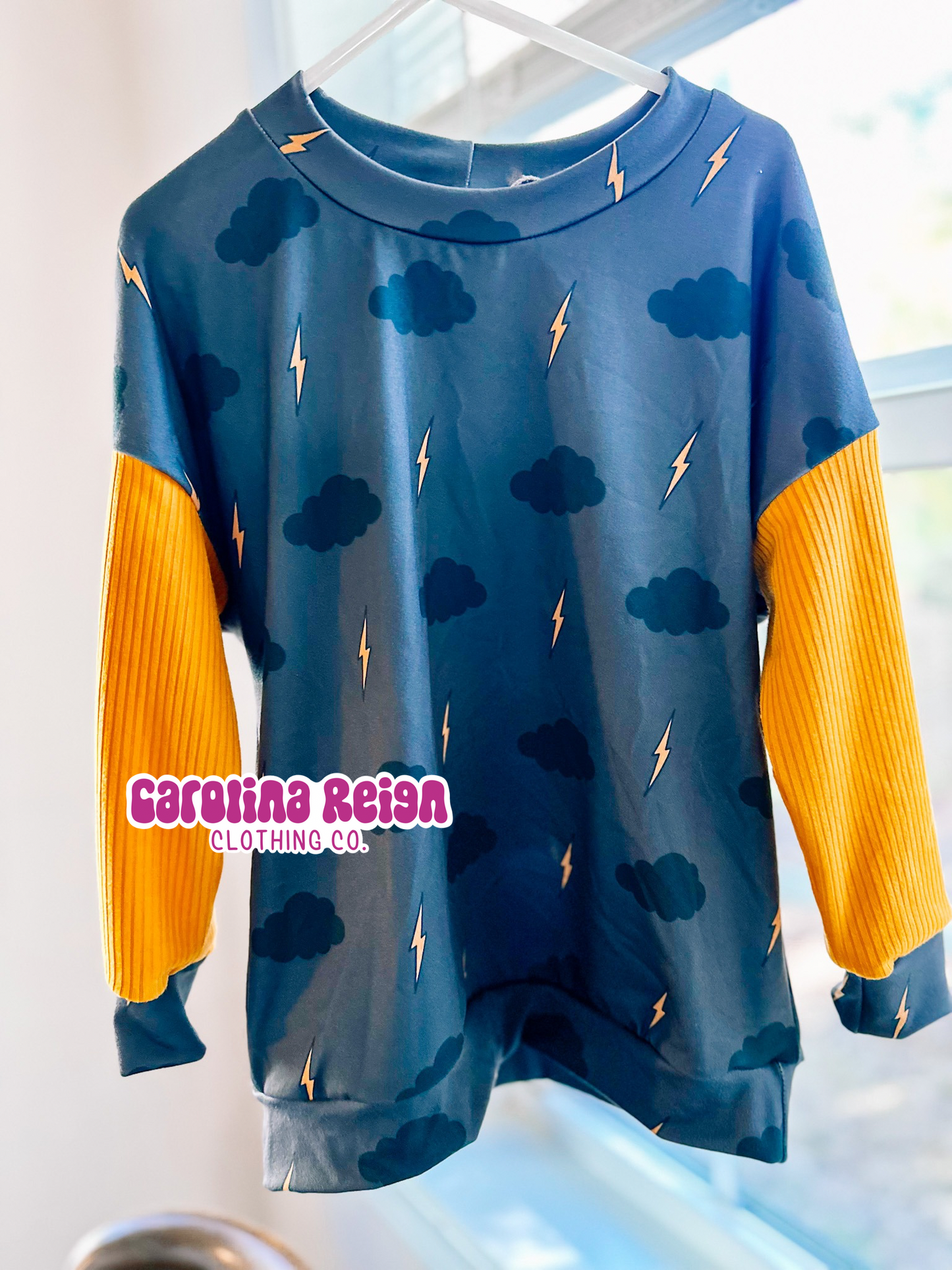 Size 5T dolman long sleeve with waistband , lightening print